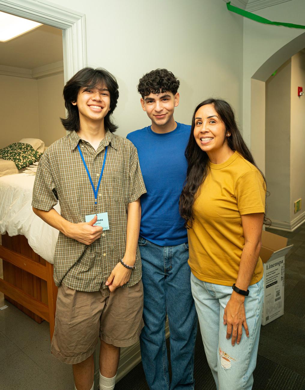 Thomas Aguilar, Ricardo Camacho and Ricardo's mother in a dorm at Pomona College