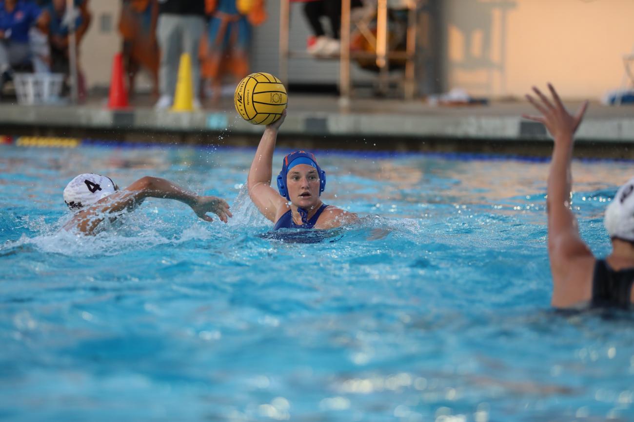Madison Lewis '24 prepares to take a shot in a water polo game