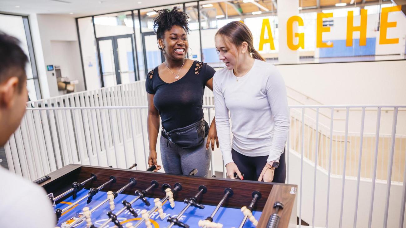 Students playing fooz ball at the CARW