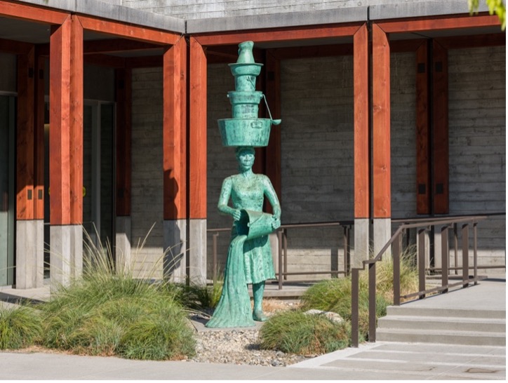 sculpture of female figure in outdoor courtyard