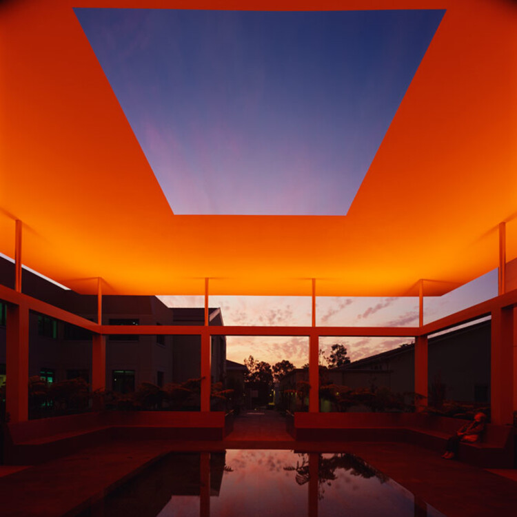 Nighttime view of the James Turrell Skyspace with red-orange lighting
