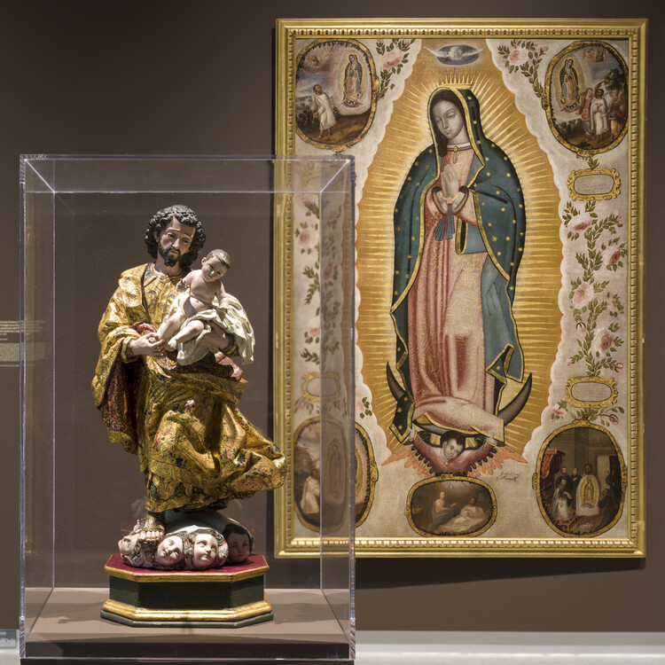 sculpture in foreground, painting in background