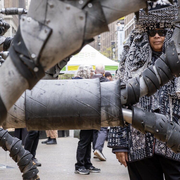 artist with sculpture