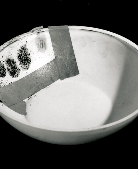 John Baldessari, Evidence: Bowl Handed to Helene Winer Dec. 1, 70, 1970. Typed text, bowl, tape, and lamp black. (Bowl was later destroyed.) Photo documentation: black-and-white photograph, 8 x 10.25 in. (20.3 x 25.4 cm). Collection of the artist