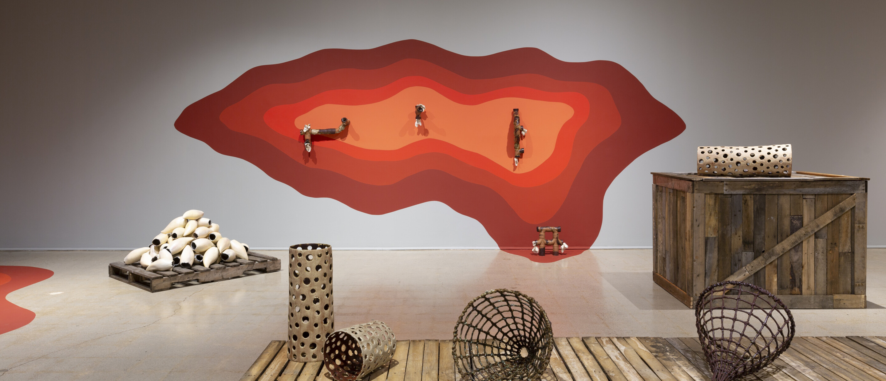 Installation view of Courtney Leonard's exhibition with sculpture and paintings