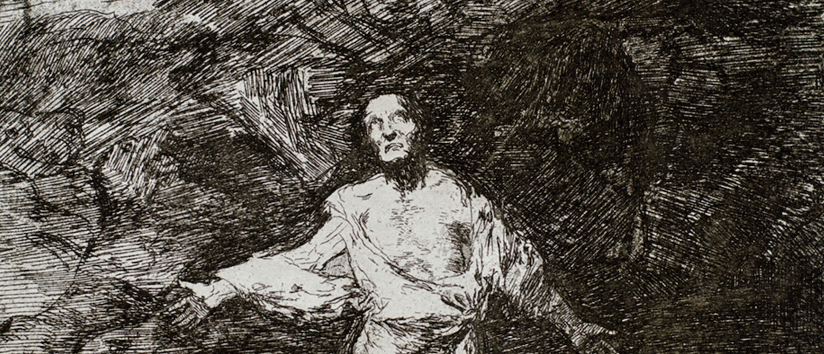 figure kneeling down against dark background