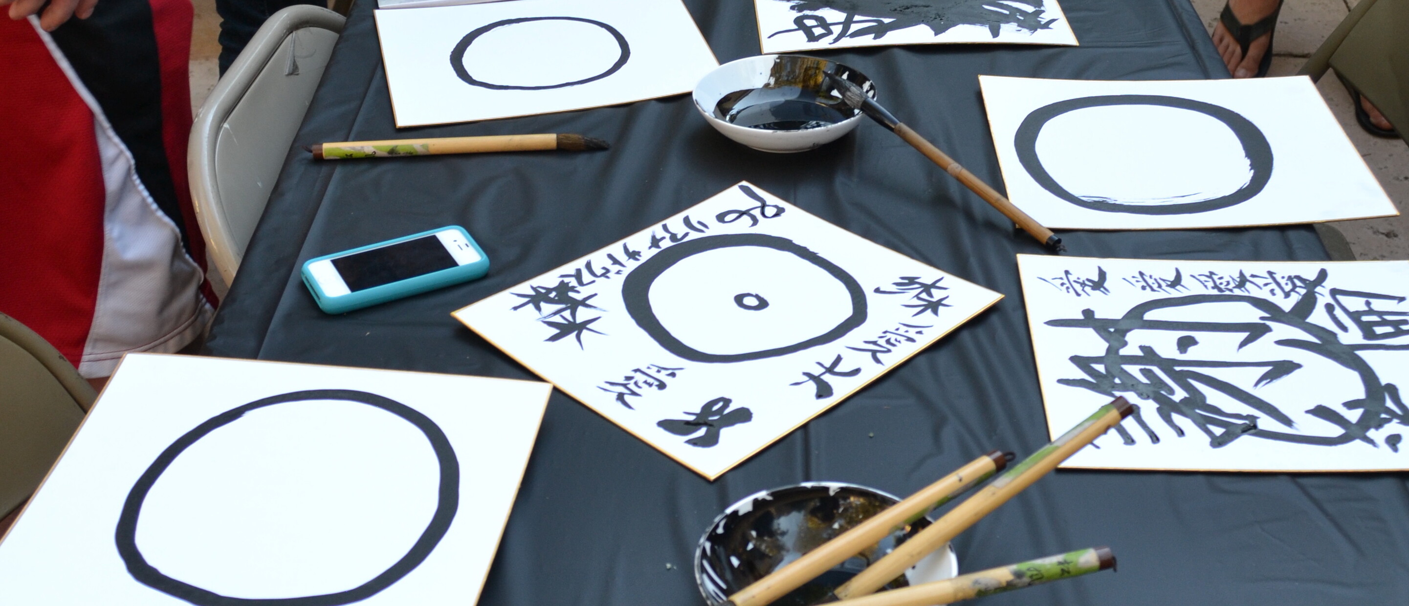 Calligraphy boards with brushs and circular strokes
