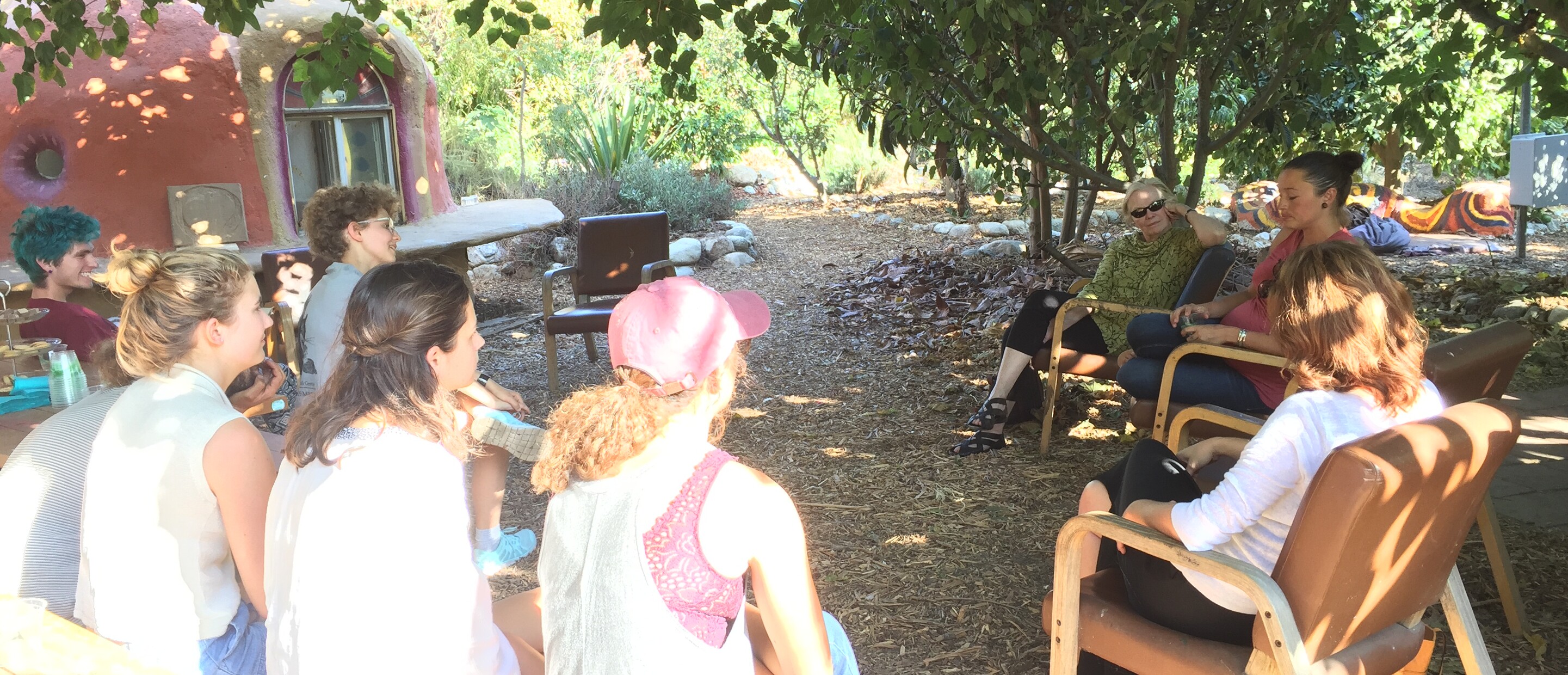 Outdoor group of people in circle talk