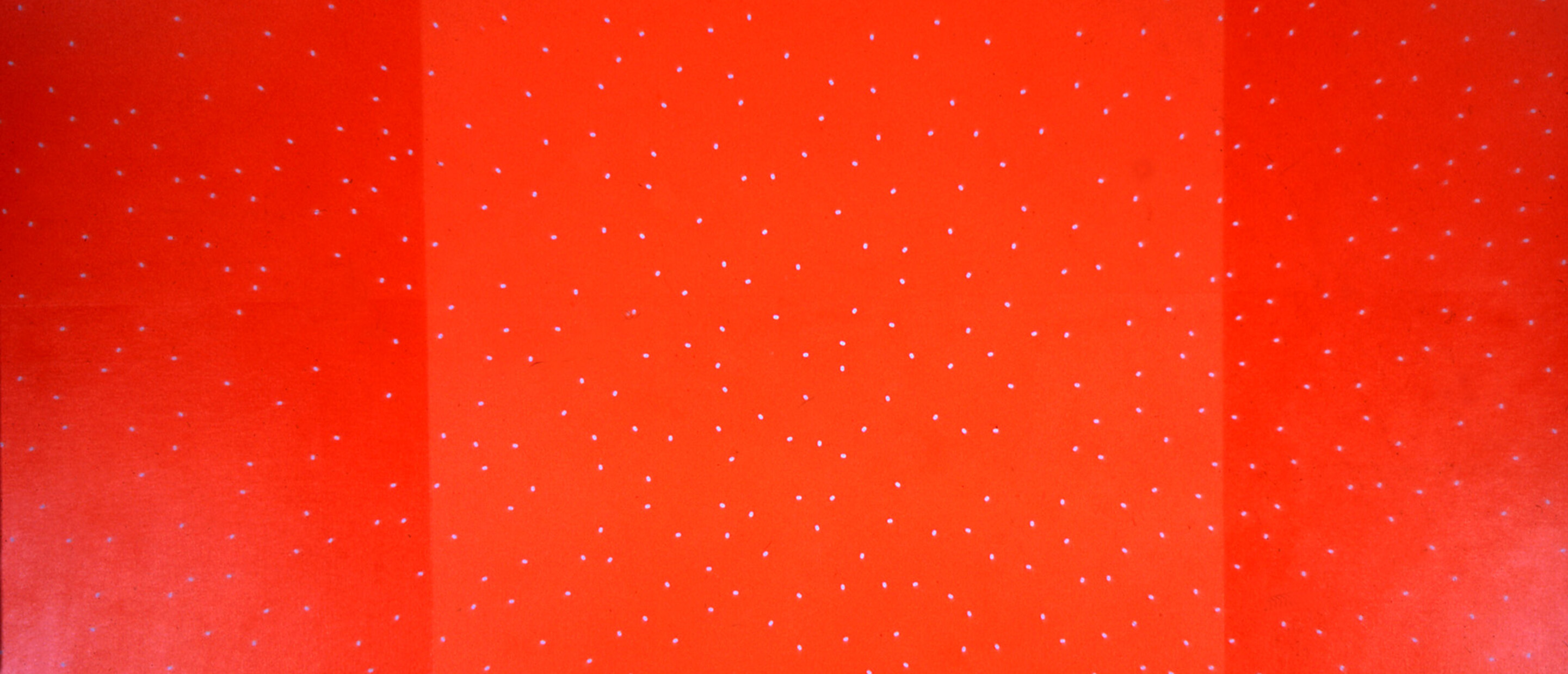 Multiple hues of red with dots painted on canvas