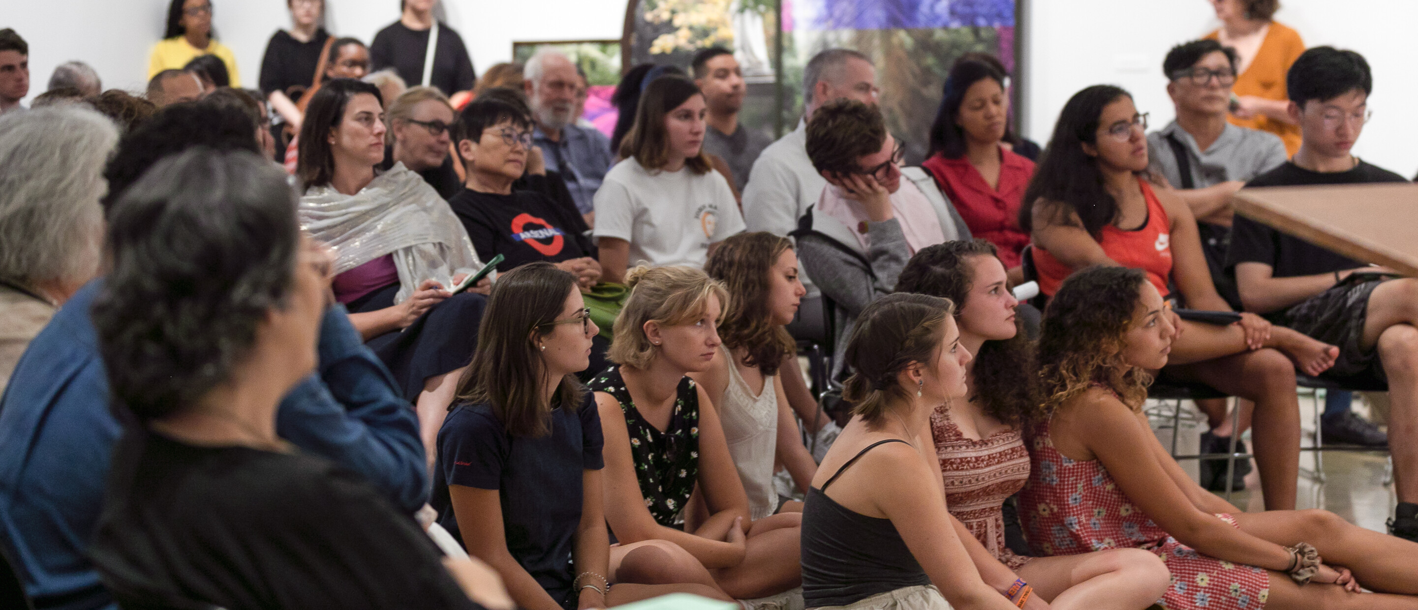 Audience members at an event inside the museum gallery