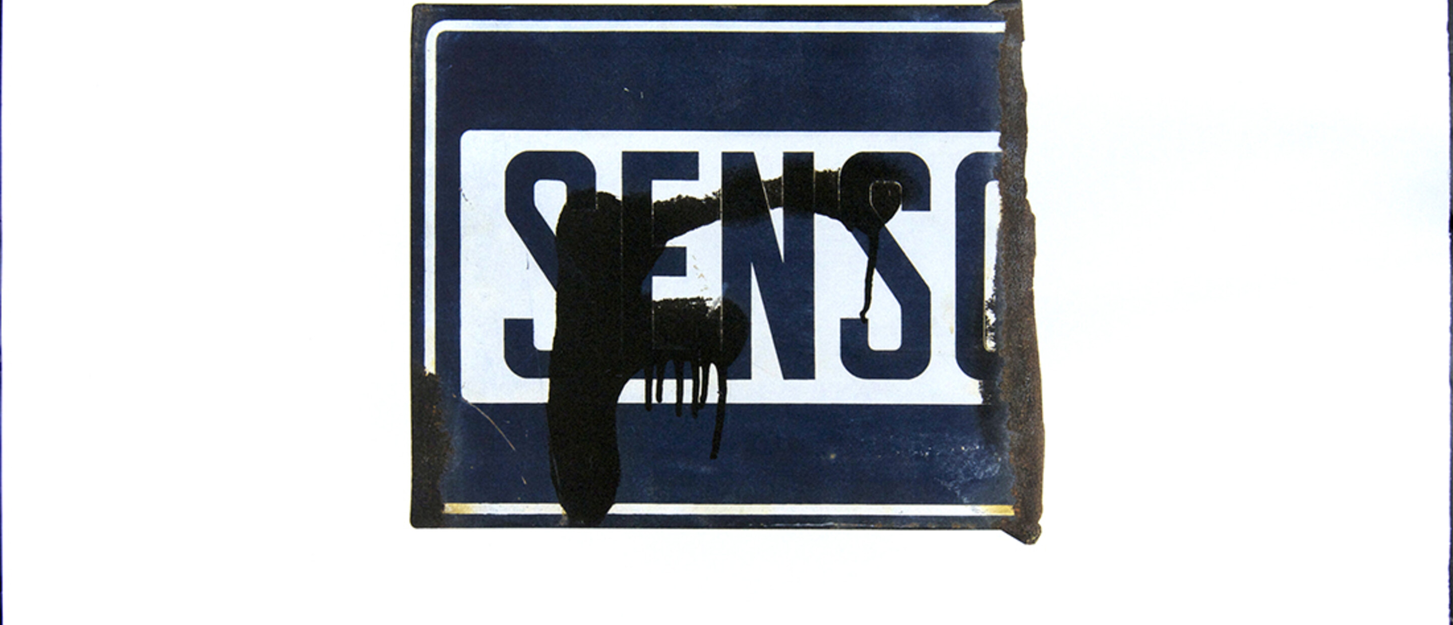 Perdita di senso (Loss of Sense), 1997, offset lithography on paper, 19 ¾ x 27 3/8 in. (50.17 x 69.53 cm.) senso unico = one way (street sign). Pomona College Collection. Gift of the artist.   