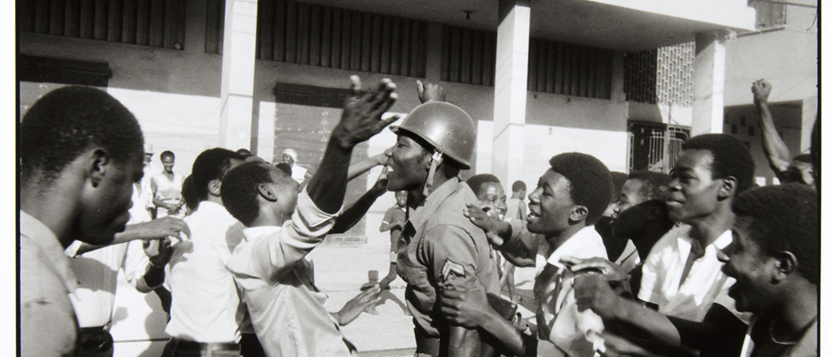 Danny Lyons, The soldier is greeted as hero. February 7, Port-au-Prince, 1983-86, Silver gelatin print, 8 1/2 x 13 in.