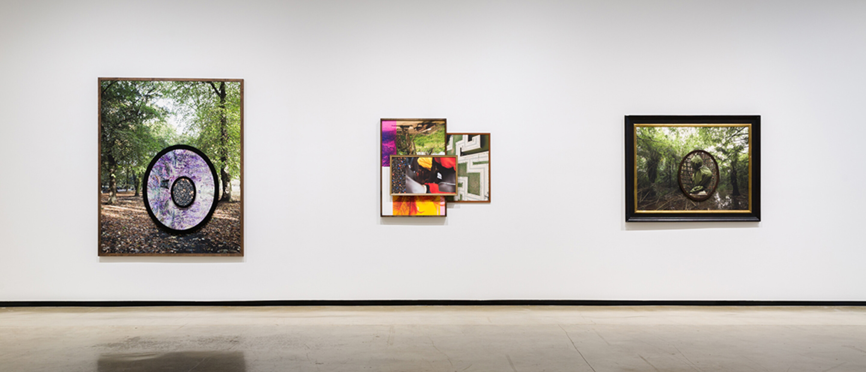 Installation view of exhibition with composite photographs mounted on walls
