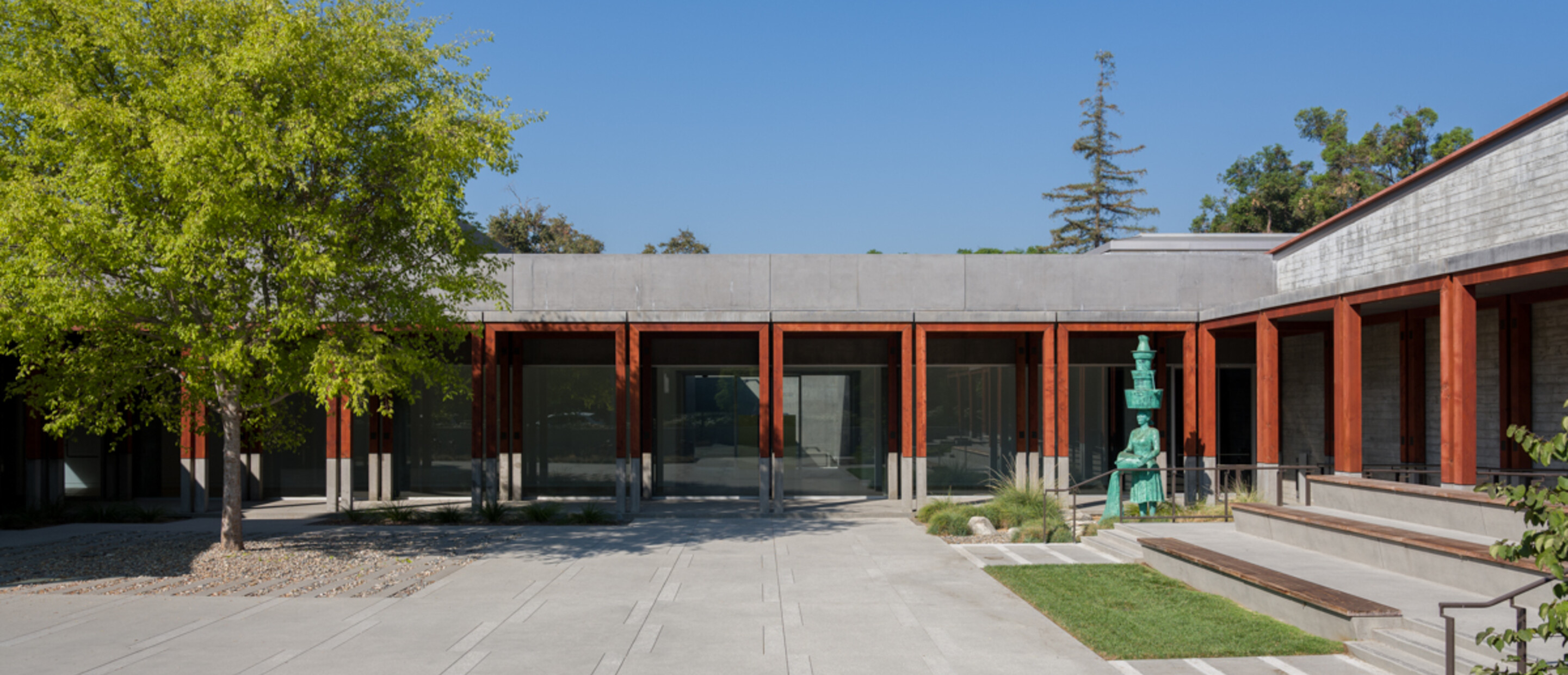 Courtyard view with tall bronze sculpture 