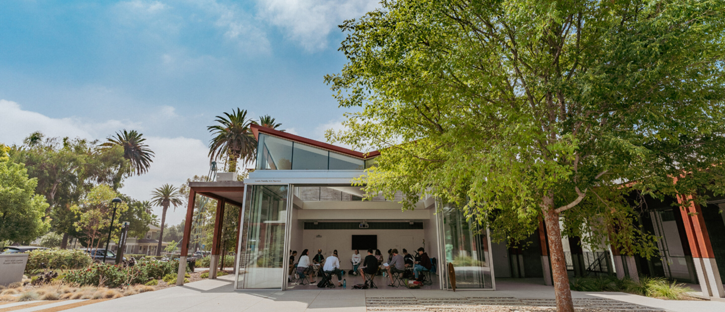 Outdoor looking into a pavilion with students in class