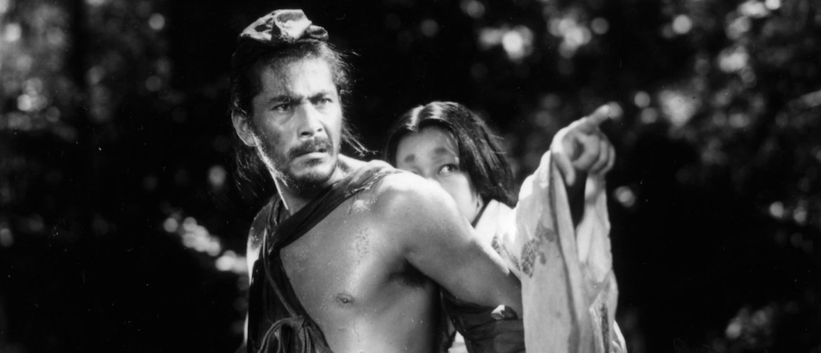 film still from Rashomon film with the thief and wife characters