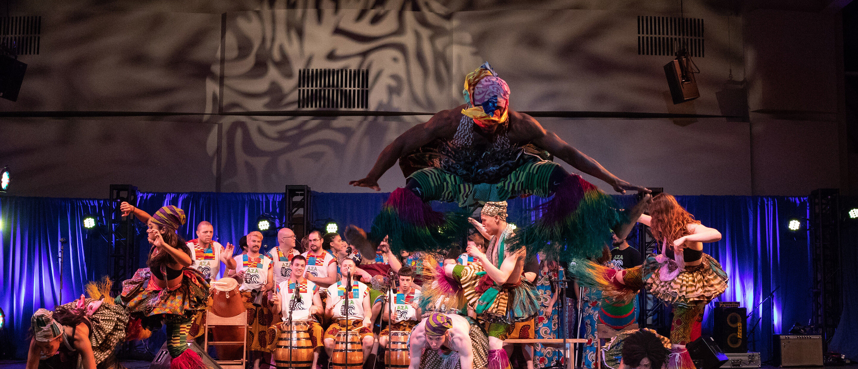 ensemble of dancers drummers and singers