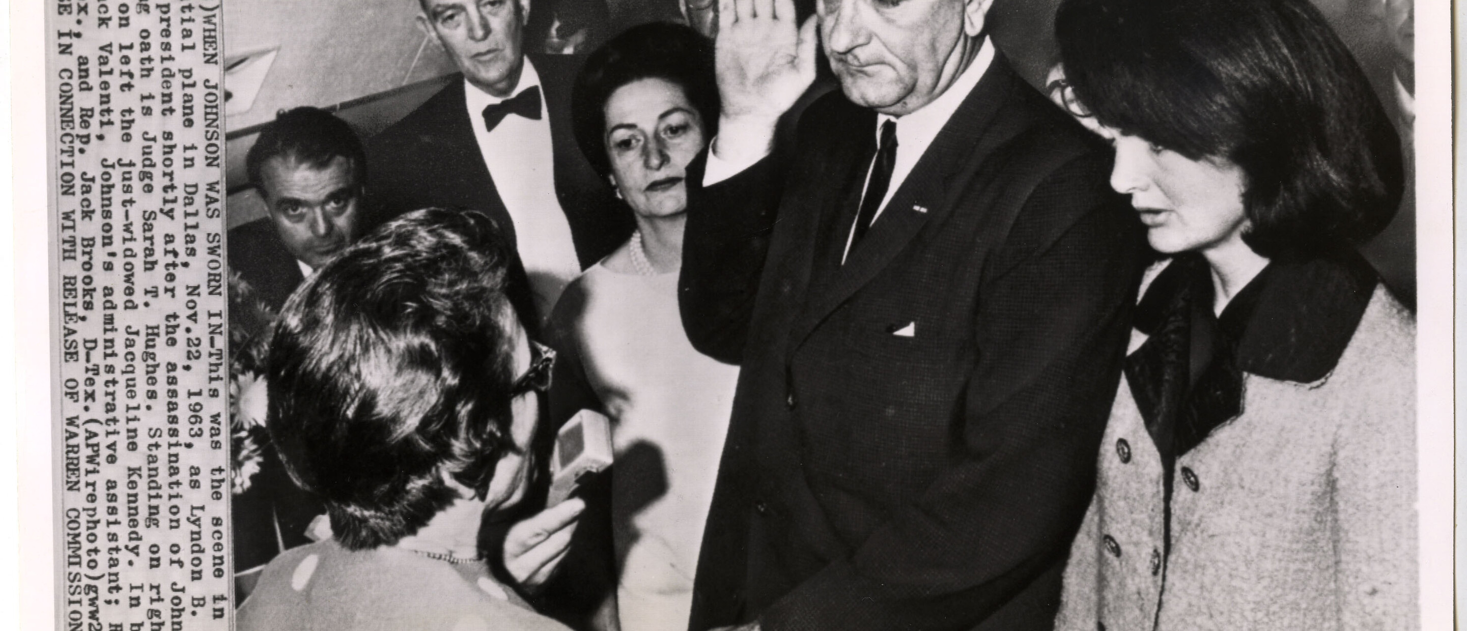 B&W photograph of President Lyndon B. Johnson being sworn in with Jackie Kennedy