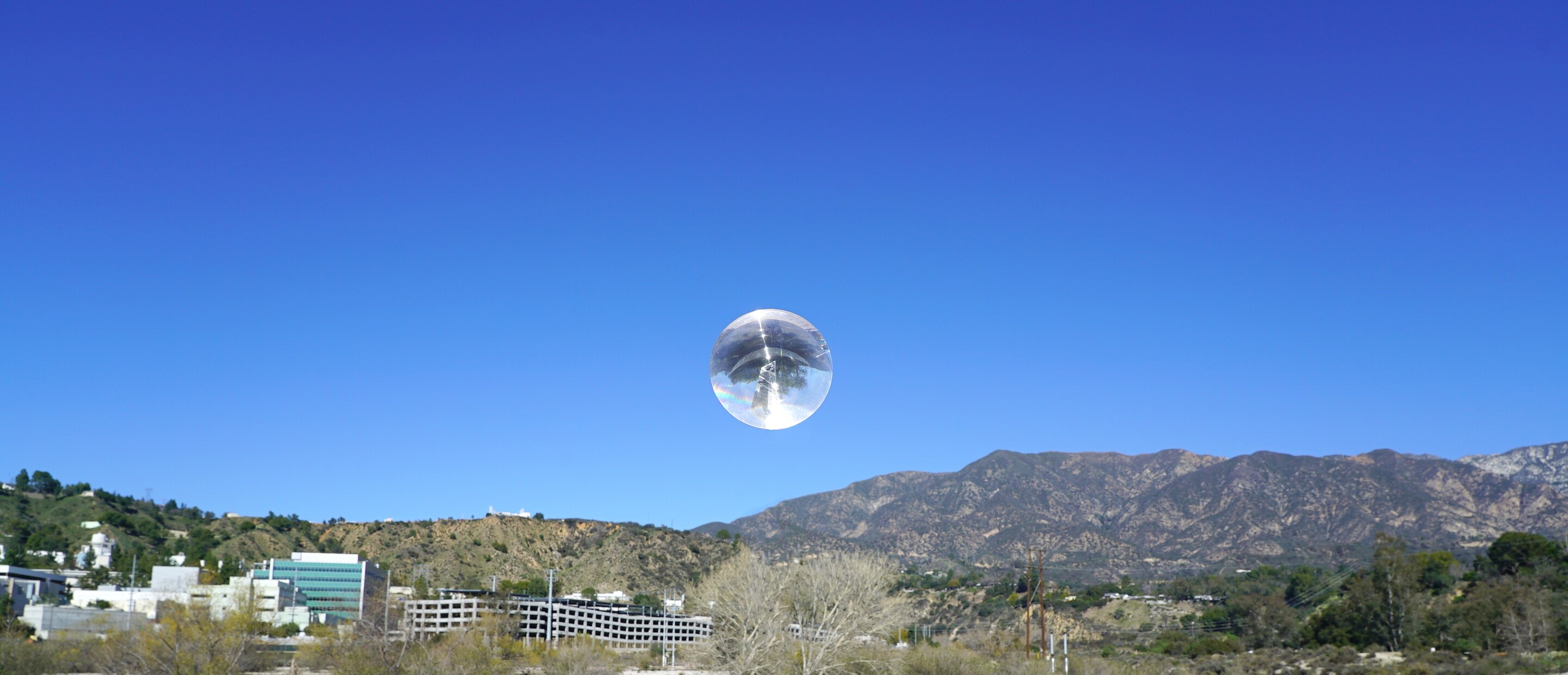 sphere over desert landscape