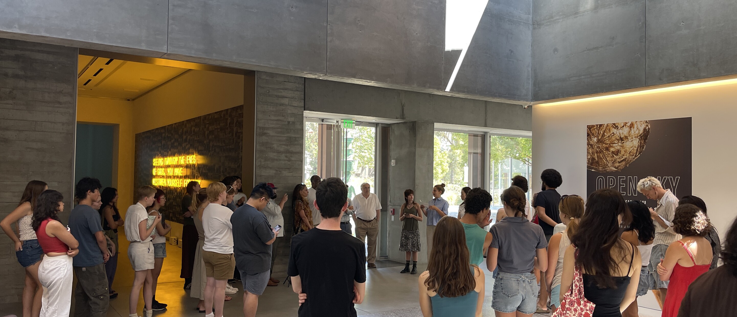 People gathered in museum lobby