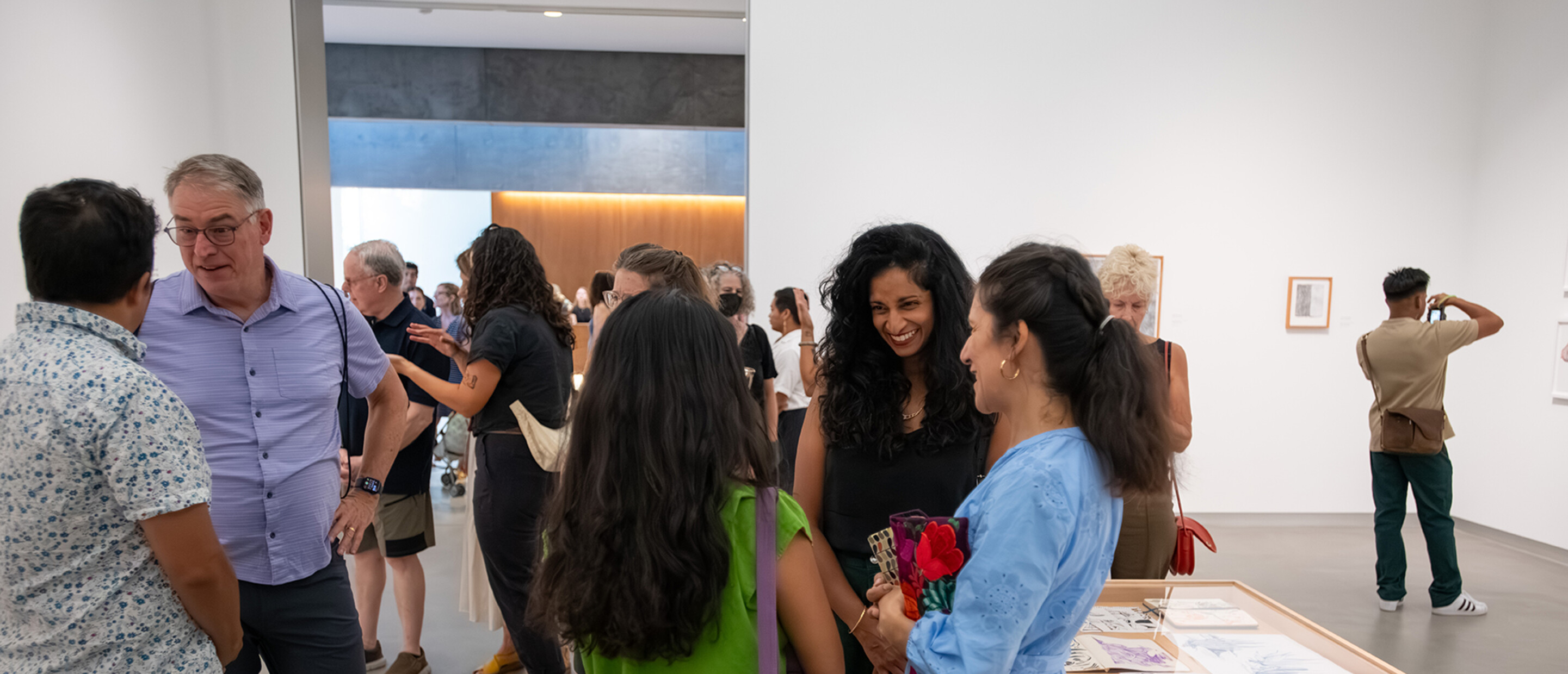 festive crowd in art gallery