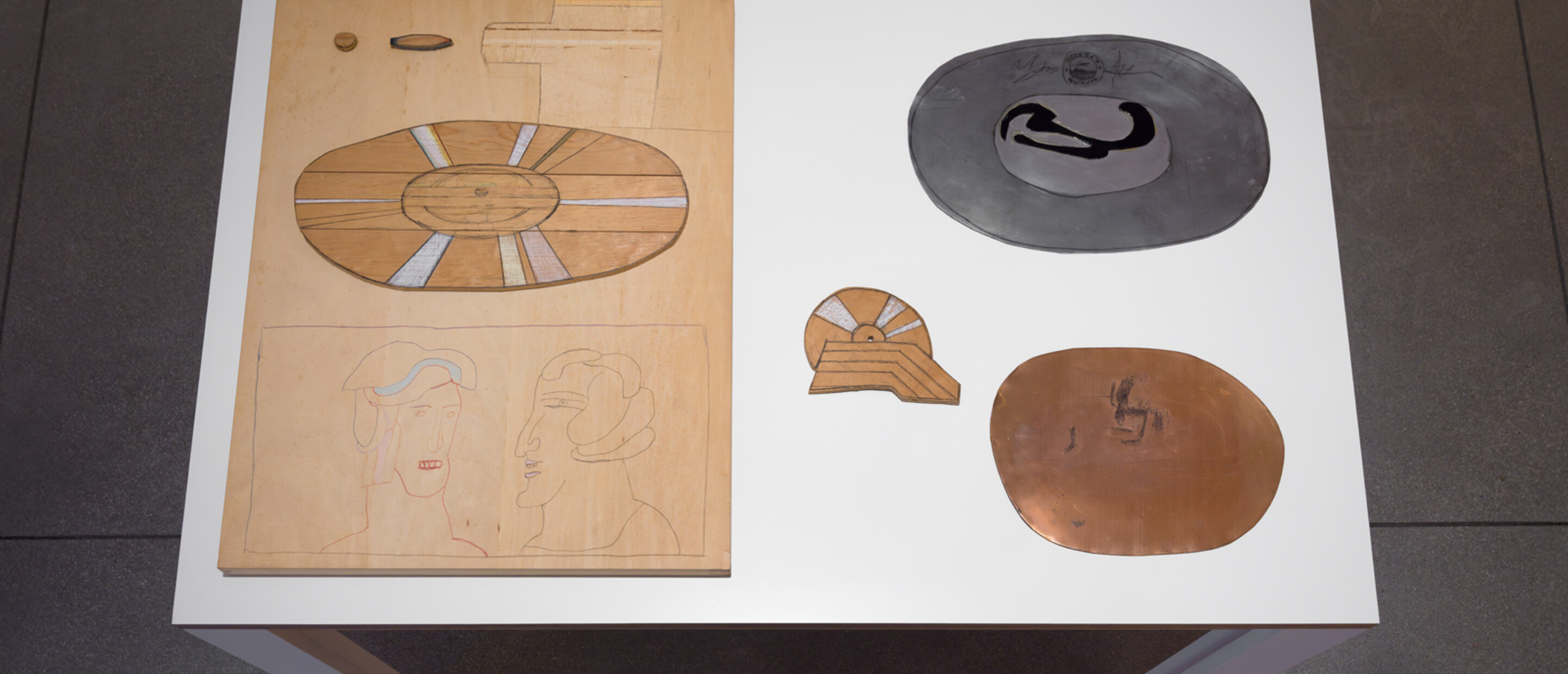 medium close-up shot of a table with three-dimensional artworks