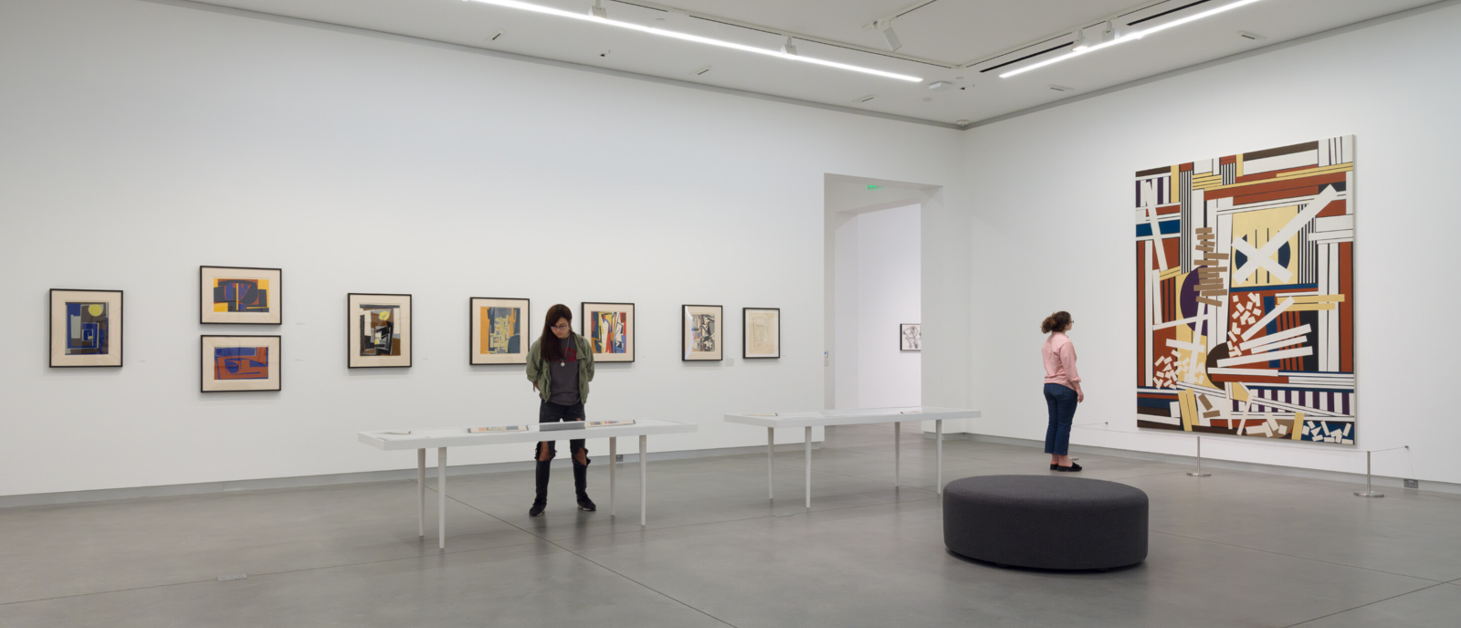 wide shot of two visitors in gallery