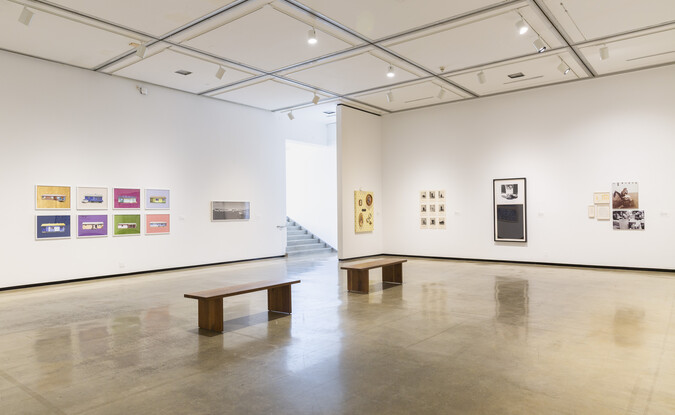 Installation view of an exhibition with artworks on the wall