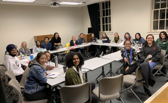 Classroom of students in a rectangular roundtable 