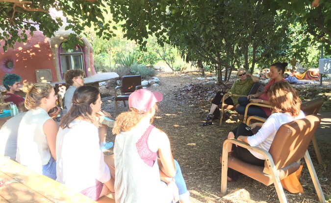 Outdoor group of people in circle talk