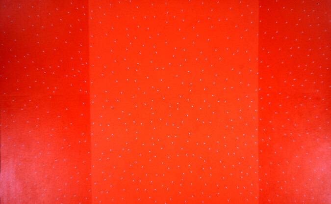 Multiple hues of red with dots painted on canvas