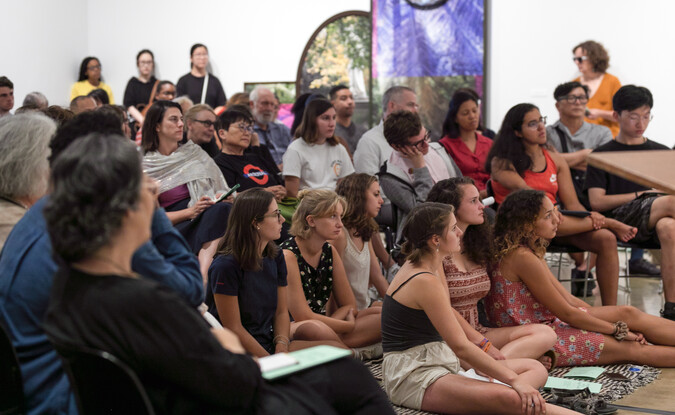 Audience members at an event inside the museum gallery