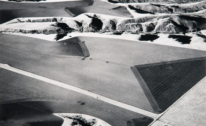 Marilyn Bridges, Farmer's Edge, Badlands, 1984, 20 x 24 in. Gelatin Silver Print on Paper. Pomona College Collection. Gift of Doug and Joan Hansen. 