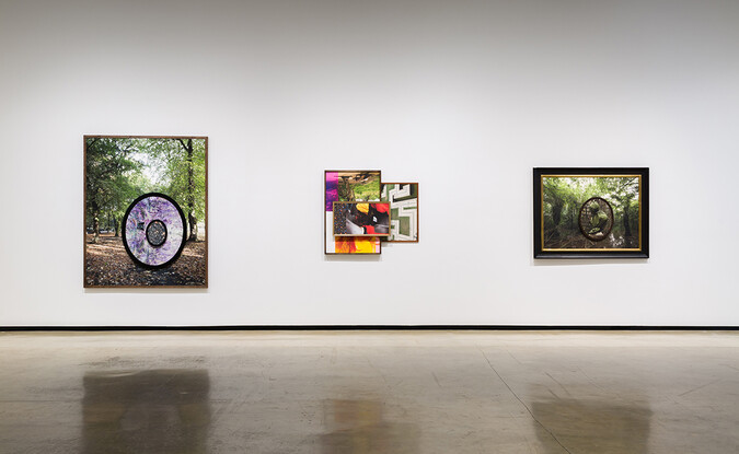 Installation view of exhibition with composite photographs mounted on walls