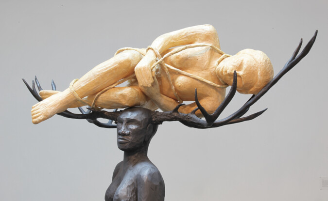 sculpture of 2 bodies