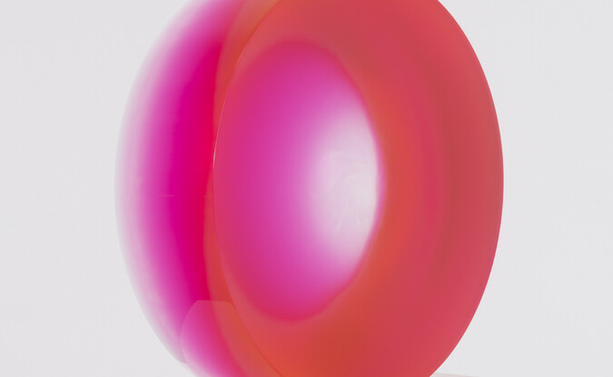 Pink disc on white pedestal