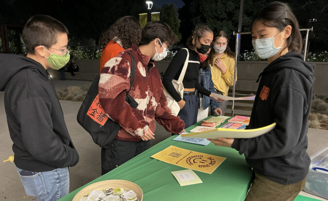 students selling art 