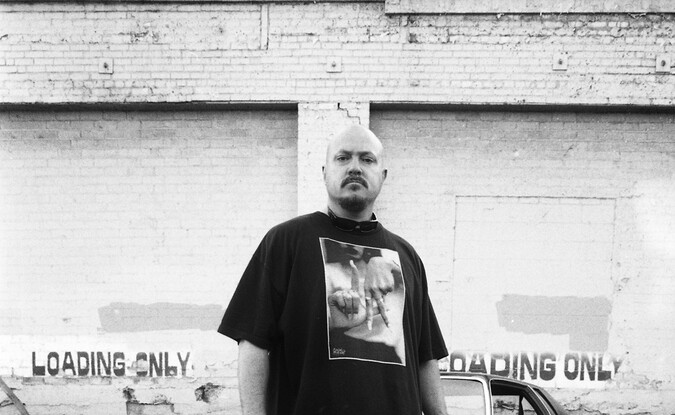 Man standing in front of car 