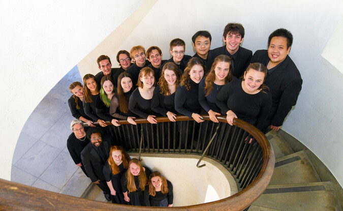 Glee club members on stairwell