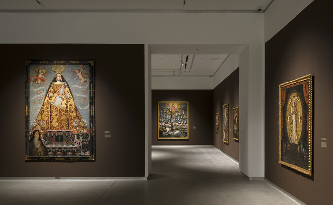 brown gallery with doorway and large paintings