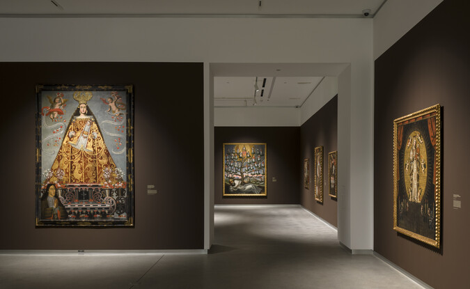 brown gallery with doorway and large paintings
