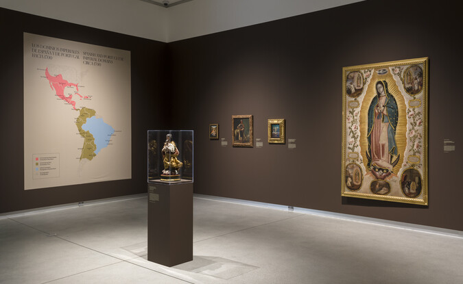 brown gallery with map and large paintings