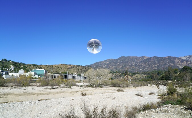 sphere over desert landscape