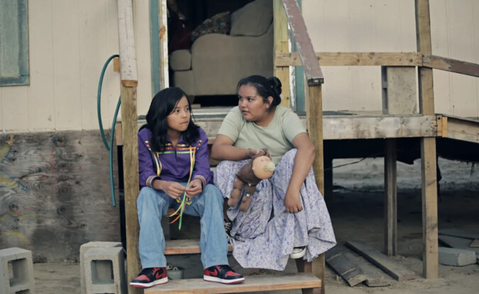 Two kids sitting on steps