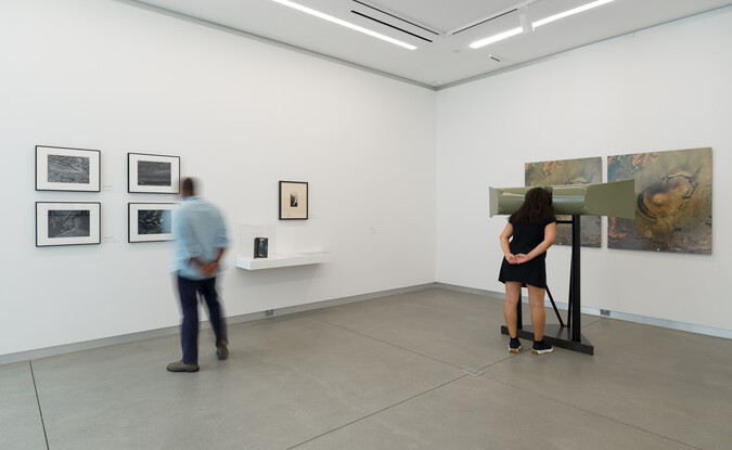 people looking at art