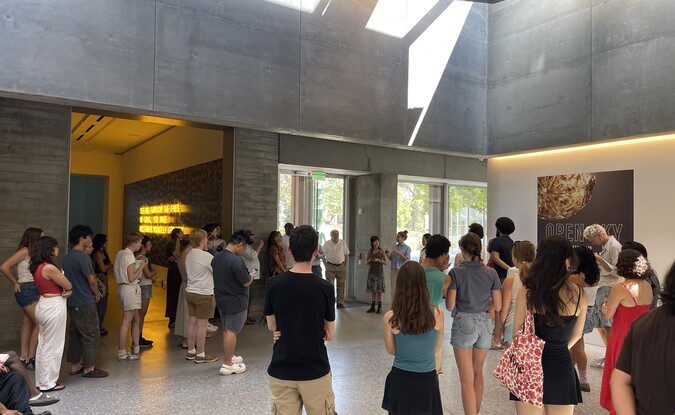 People gathered in museum lobby