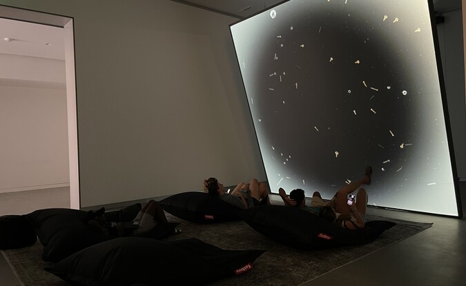 People watching art video