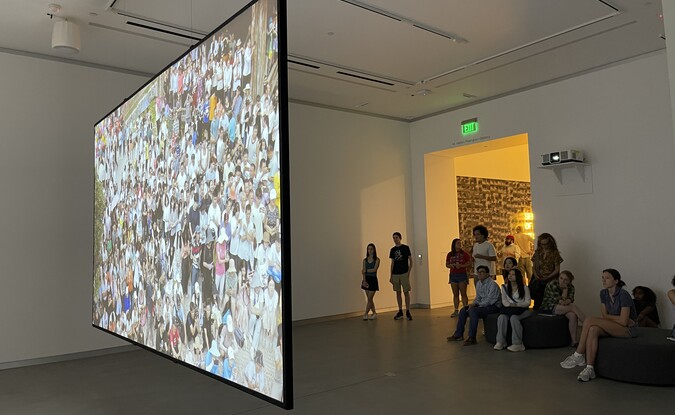 People watching art video