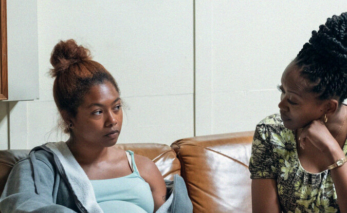 Two black women sitting