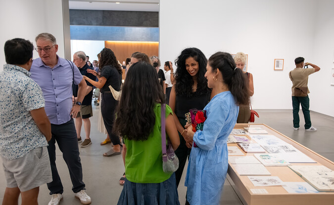 festive crowd in art gallery